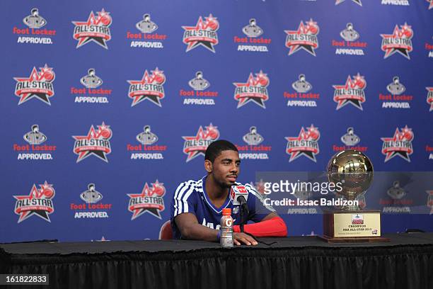 Kyrie Irving of the Cleveland Cavaliers talks to the media after winning the Foot Locker Three-Point Contest on State Farm All-Star Saturday Night...