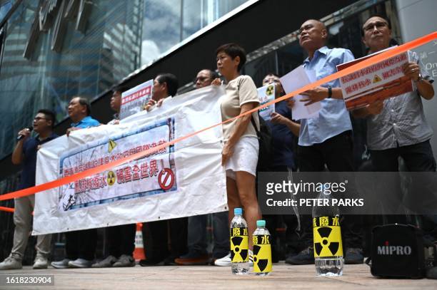 Hong Kong fishermen hold a protest outside the Japanese consulate in Hong Kong on August 22 a day after Tokyo announced its plan to release treated...