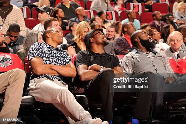 Russell Westbrook and Kevin Durant of the Oklahoma City Thunder and James Harden of the Houston Rockets watch the 2013 Foot Locker Three-Point...