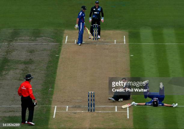 Nathan McCullum of New Zealand collides with Jonathan Trott of England during the first match of the one day international series between New Zealand...