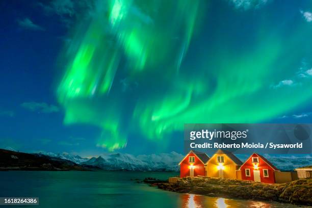 northern lights over the frozen arctic sea - bizarre stock pictures, royalty-free photos & images