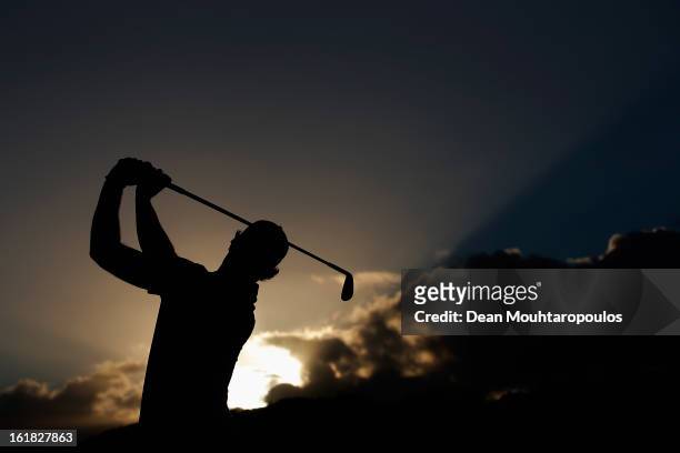 Magnus A. Carlsson hits a practice shot on the driving range prior to the Final Day of the Africa Open at East London Golf Club on February 17, 2013...