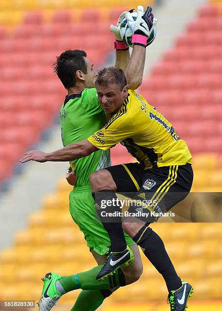 Ben Sigmund of the Phoenix crashes into goal keeper Michael Theo of the Roar during the round 21 A-League match between the Brisbane Roar and the...