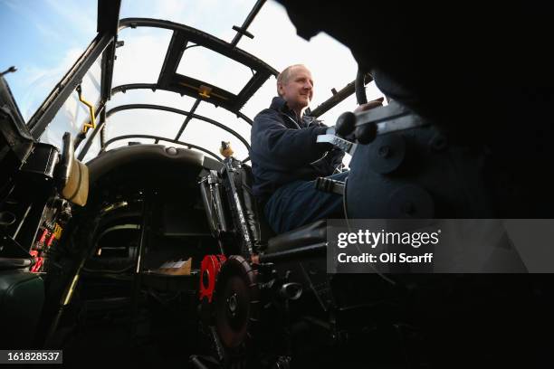 Engineer Keith Breachley in the cockpit of the Lancaster bomber "Just Jane" which is being restored with the aim of getting it airworthy, at...