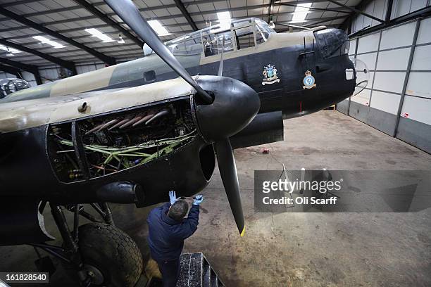 Engineer Bob Mitchell works on the Lancaster bomber "Just Jane" , with the aim of getting it airworthy, at Lincolnshire Aviation Heritage Centre on...