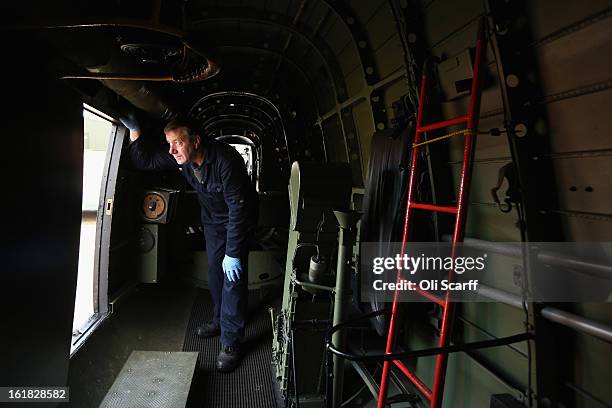 Engineer Bob Mitchell inspects the Lancaster bomber "Just Jane" , with the aim of getting it airworthy, at Lincolnshire Aviation Heritage Centre on...