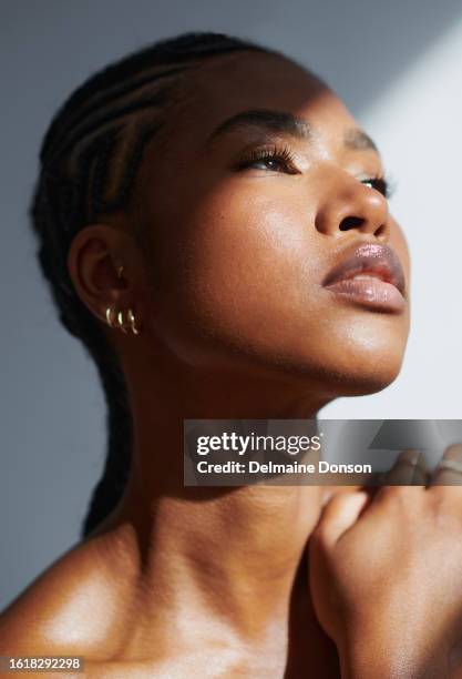 sun shines over a beautiful black woman. stock photo - black neck stock pictures, royalty-free photos & images
