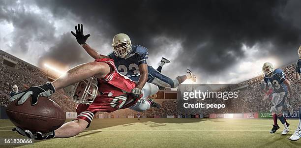american football players - tackling stock pictures, royalty-free photos & images