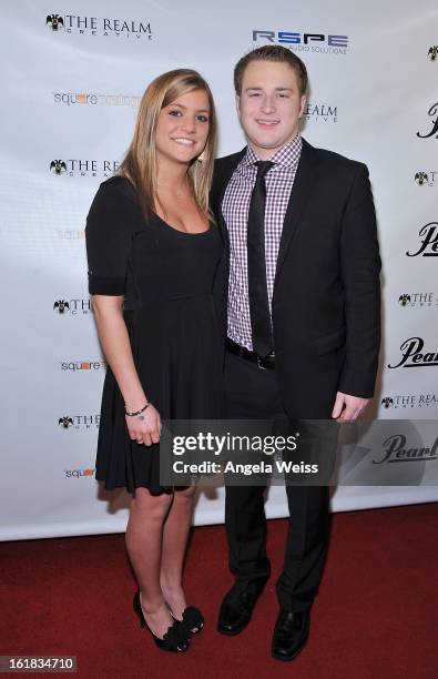 Amanda Chruscicki and George Liberty attend The Realm Creative red carpet premier party on February 16, 2013 in Los Angeles, California.