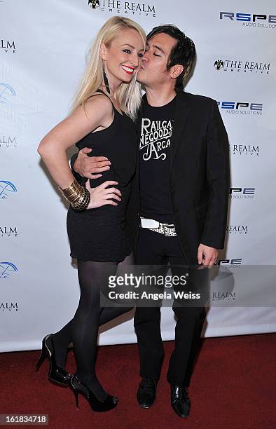 Tanya Dahl and Johnny Royal attend The Realm Creative red carpet premier party on February 16, 2013 in Los Angeles, California.