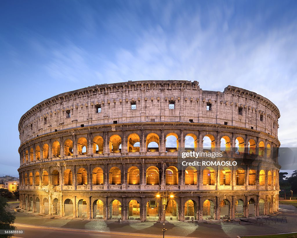 The Golden Colosseum at dusk in Rome, Italy 