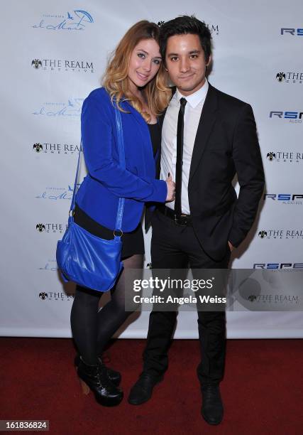 Amanda Stephens and Carl Himmelman attend The Realm Creative red carpet premier party on February 16, 2013 in Los Angeles, California.