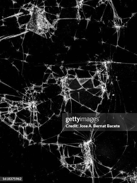 broken glass of a phone screen. - cracked iphone screen stock pictures, royalty-free photos & images