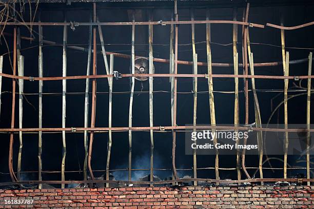 Smoke continues to rise from the site of a fire at a supermarket on February 17, 2013 in Changzhi, China. The supermarket caught fire at 4:10 a.m....