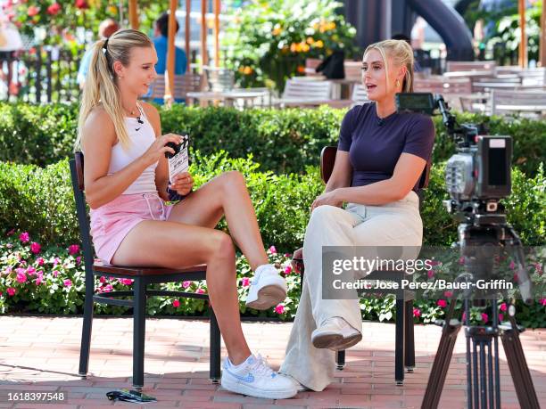 Katie Boulter and Emma Paton are seen during an interview for US Open Fan Week outside the Arthur Ashe Stadium on August 22, 2023 in New York City.