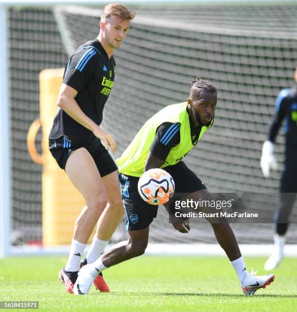 Rob Holding and Nuno Tavares of Arsenal during a training session at London Colney on August 15, 2023 in St Albans, England.