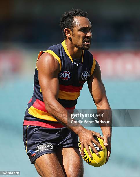 Richard Tambling of the Crows runs with the ball during the round one AFL NAB Cup match between the Adelaide Crows and the St Kilda Saints at AAMI...