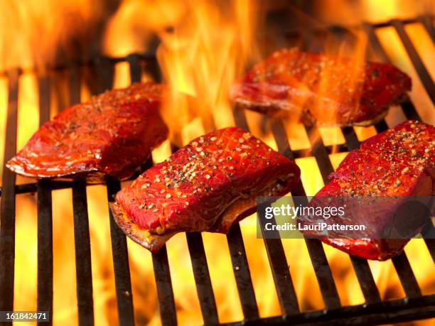 wild pacific coast salmon on the bbq - rustic salmon fillets stock pictures, royalty-free photos & images