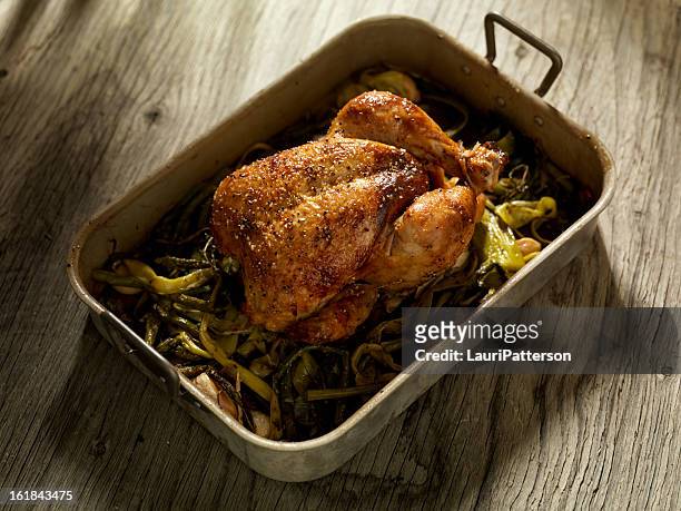 roasted chicken with asparagus and leeks - roasted chicken stock pictures, royalty-free photos & images
