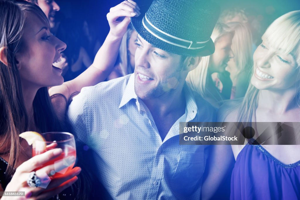 Multi ethnic people having fun in nightclub at a party