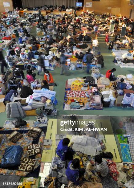 Survivors rest at a shelter in Rikuzentakata on March 19, 2011. The government of the world's third-biggest economy has been insisting that there is...