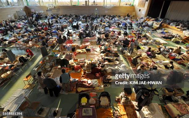 Survivors rest at a shelter in Rikuzentakata on March 19, 2011. The government of the world's third-biggest economy has been insisting that there is...