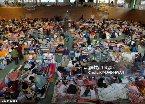 Survivors rest at a shelter in Rikuzentakata on March 19, 2011. The government of the world's third-biggest economy has been insisting that there is...