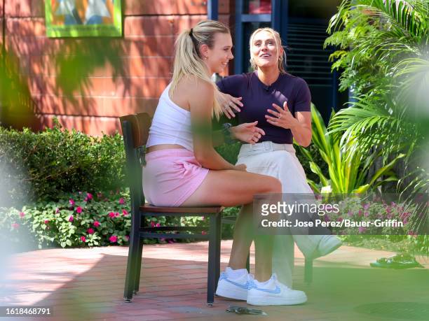 Katie Boulter and Emma Paton are seen during an interview for US Open Fan Week outside the Arthur Ashe Stadium on August 22, 2023 in New York City.