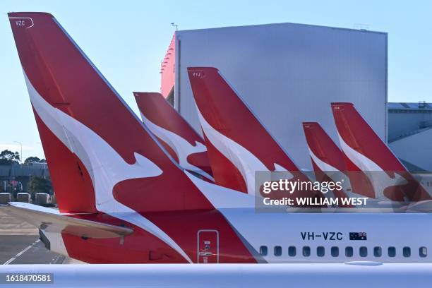 Photo taken on August 20, 2023 shows a line-up of Qantas planes at Sydney´s Kingsford Smith Airport.