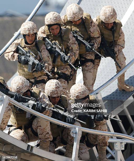 Members of the United Arab Emirates' woman armed forces participate in a military show launching the International Defence Exhibition and Conference...