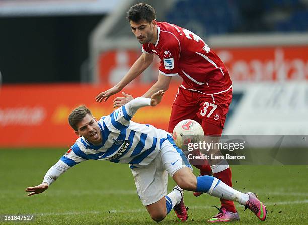 Kevin Wolze of Duisburg is challenged by Markus Karl of Kaiserslautern during the Second Bundesliga match between MSV Duisburg and 1. FC...