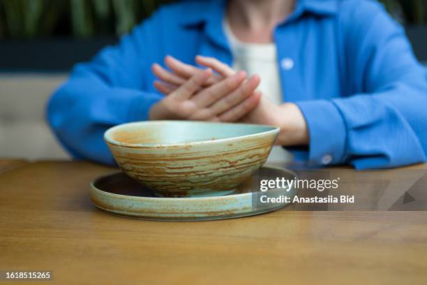 anonymous woman refuses from food,concept of eating disorder. - picky eater stock pictures, royalty-free photos & images