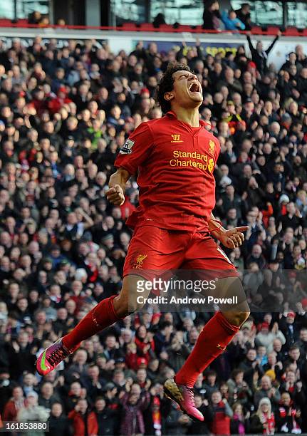 Philippe Coutinho of Liverpool celebrates after scoring his first goal for the club during the Barclays Premier League match between Liverpool and...