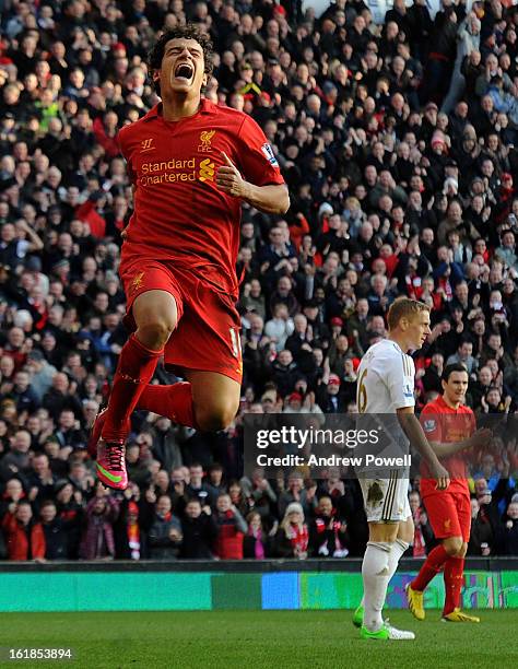 Philippe Coutinho of Liverpool celebrates after scoring his first goal for the club during the Barclays Premier League match between Liverpool and...