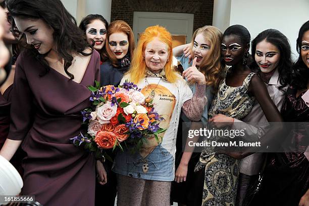 Dame Vivienne Westwood poses with models at the Vivienne Westwood Red Label show during London Fashion Week Fall/Winter 2013/14 at the Saatchi...