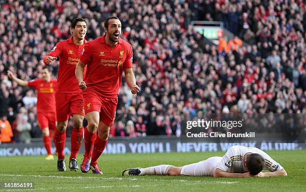 Jose Enrique of Liverpool celebrates after scoring the third goal during the Barclays Premier League match between Liverpool and Swansea City at...