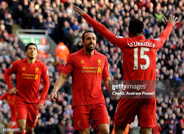 Jose Enrique of Liverpool celebrates his goal with Luis Suarez and Daniel Sturridge during the Barclays Premier League match between Liverpool and...