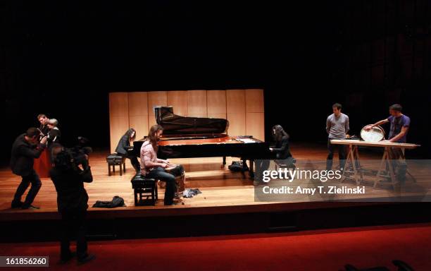 Camera crew record the musicians as French sisters, concert pianists Katia Labeque and Marielle Labeque rehearse with the Kalakan Trio on percussion...
