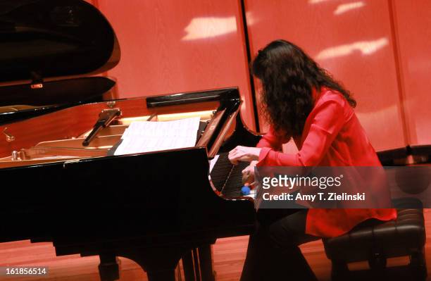 French concert pianist Marielle Labeque uses a percussion instrument as she performs with her sister Katia Labeque and the Kalakan Trio on percussion...