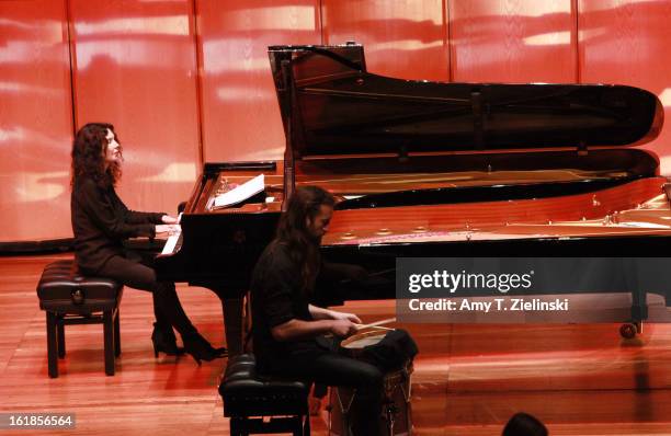 Musician Jamixel Bereau of the Kalakan Trio performs on his percussion instrument during a recital with French sisters, concert pianists Katia...