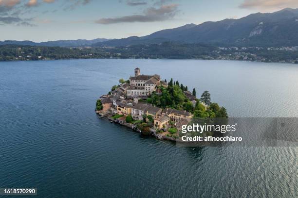 aerial view of san giulio island in lake orta, novara, piedmont, italy - view into land stock pictures, royalty-free photos & images