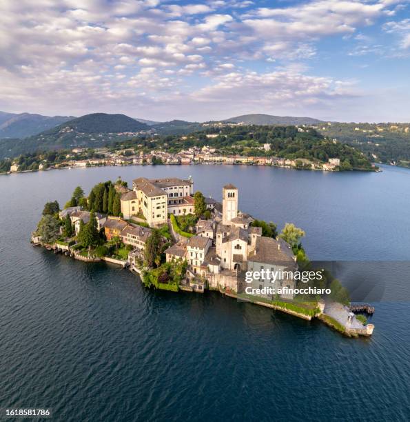 aerial view of san giulio island (st julius island) and orta san giulio in lake orta, novara, piedmont, italy - lake orta stock pictures, royalty-free photos & images
