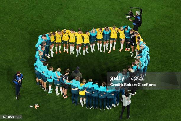 Australia players huddle after the team's 1-3 defeat following the FIFA Women's World Cup Australia & New Zealand 2023 Semi Final match between...