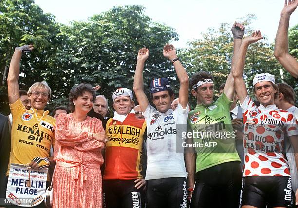 Frenchman Laurent Fignon, wearing the Yellow Jersey of the overall winner of the 70th Tour de France, Mrs Edwige Avice, French Sport Minister, Daniel...