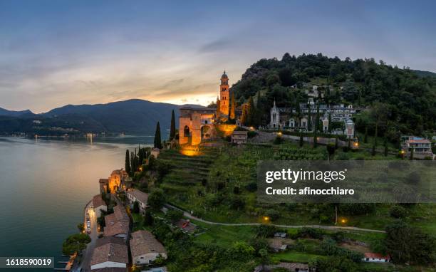 aerial cityscape with church madonna del sasso by lake lugano, vico morcote, switzerland - locarno stock pictures, royalty-free photos & images