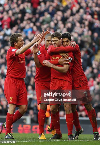 Steven Gerrard of Liverpool celebrates with Luis Suarez,Glen Johnson and Lucas after scoring the first goal from the penalty spot during the Barclays...