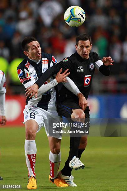 Hector Herrera of Pachuca struggles for the ball with Christian Gimenez of Cruz Azul during the Clausura 2013 Liga MX at Hidalgo Stadium on February...