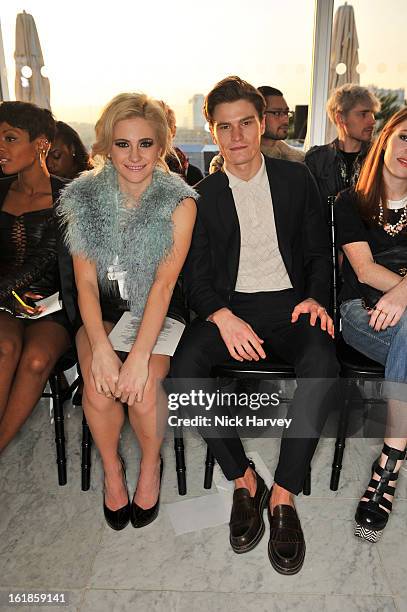 Pixie Lott and Oliver Cheshire attend the Mark Fast salon show during London Fashion Week Fall/Winter 2013/14 at ME Hotel on February 17, 2013 in...