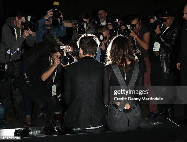 Louis Tomlinson and girlfriend Eleanor Calder attends the Unique show during London Fashion Week Fall/Winter 2013/14 at TopShop Show Space on...