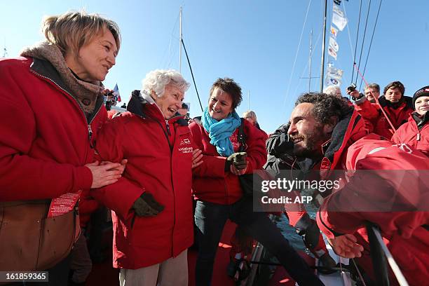 French skipper Tanguy de Lamotte looks at his grand mother Nicole de Kerautem and relatives on February 17, 2013 in Les Sables-d'Olonne, western...